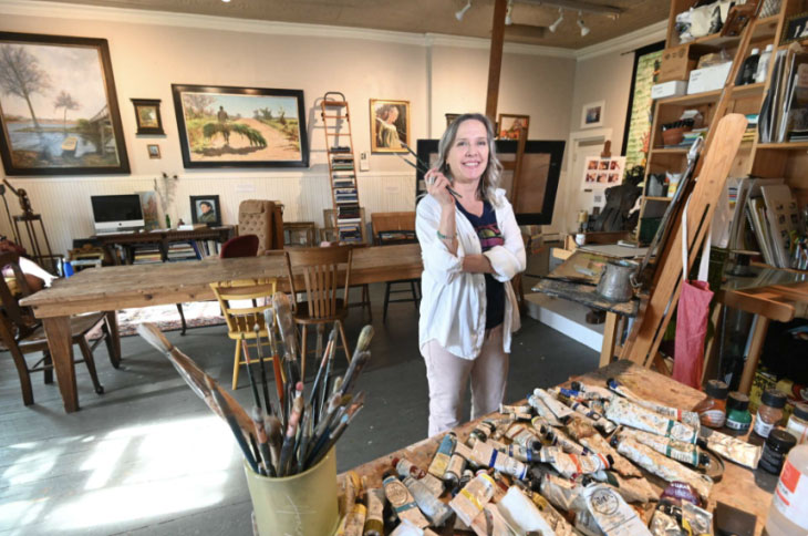 Kelly Sullivan standing in her Lambertville New Jersey art studio.